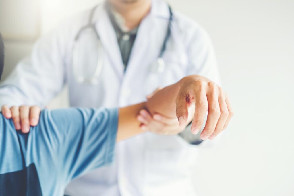 Midsection doctor examining patient hand hospital 1048944 6203115 Midsection doctor examining patient hand hospital 1048944 6203115